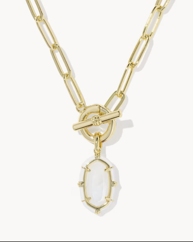 Elisa gold enamel link chain necklace with a toggle clasp and a dangling oval white enamel pendant, shown on a light gray background.